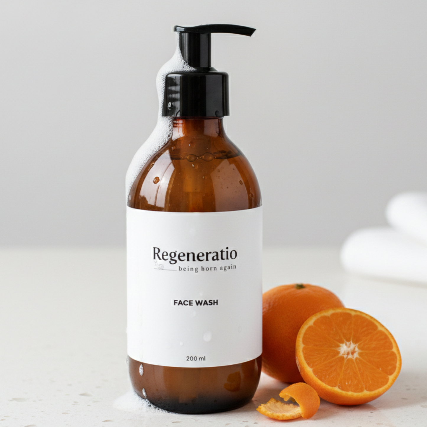 Regeneratio face wash cleanser next to citrus for fresh daily skincare